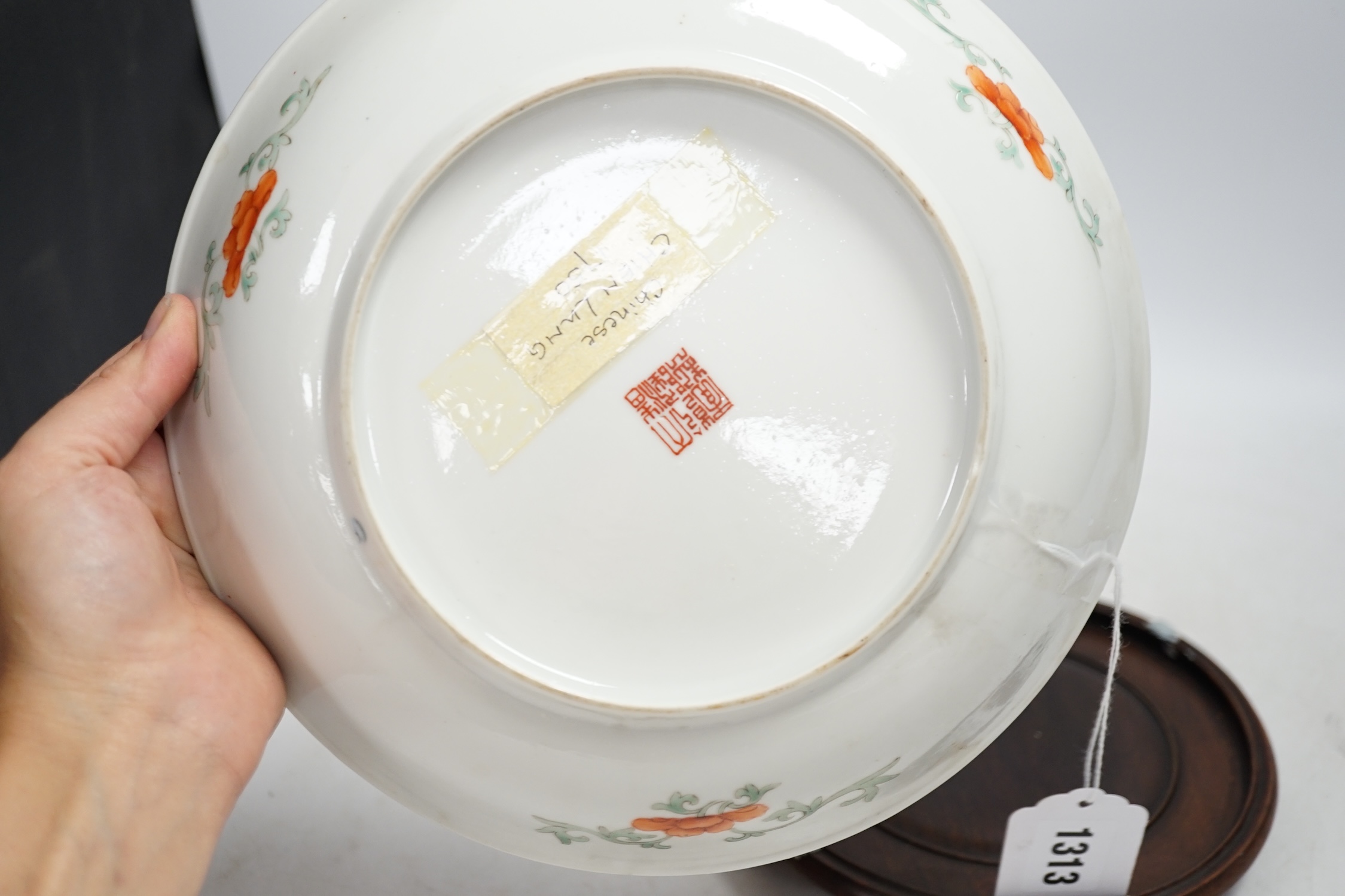A Chinese enamelled porcelain millefleur dish, Qianlong mark, early 20th century, 24cm diameter. Condition - good